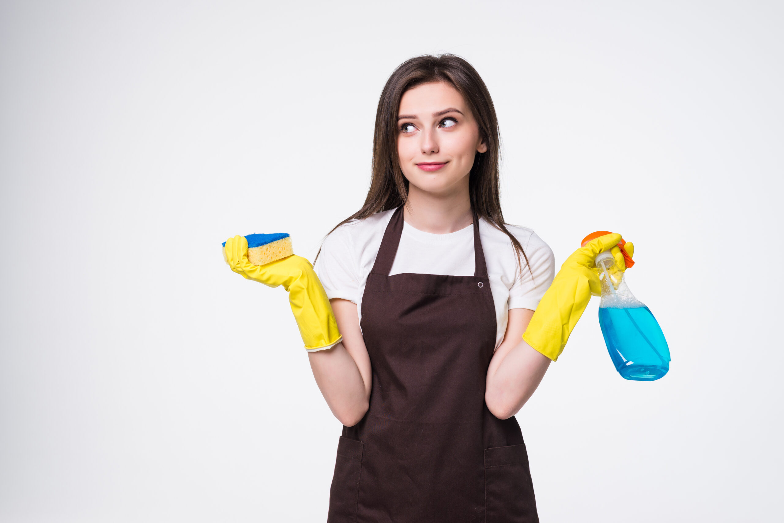 young housewife cleaning with rug and detergent isolated on white background
